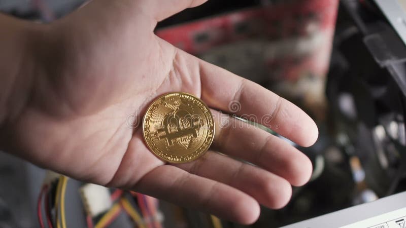 Man open and close hand with bitcoin stock video footage