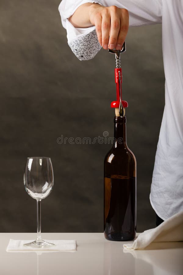 Man Opening Bottle of Wine with Corkscrew Stock Photo Image of