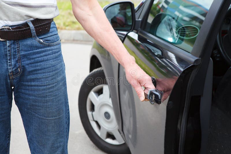Man opening car door stock photo. Image of lifestyles 25638862