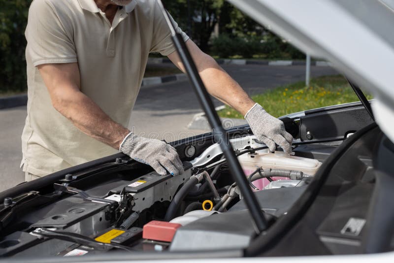 Man Opens Cap of Expansion Tank in Car Stock Image Image of