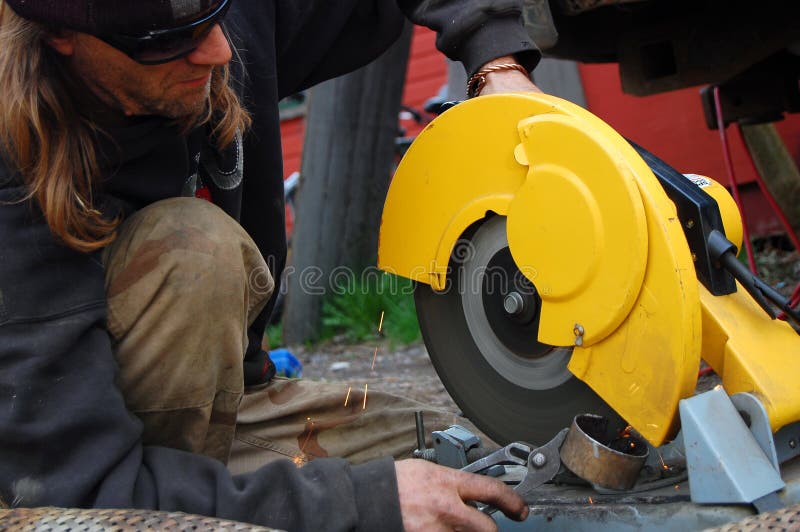 Man Operating A CutOff Saw Picture. Image 5174243