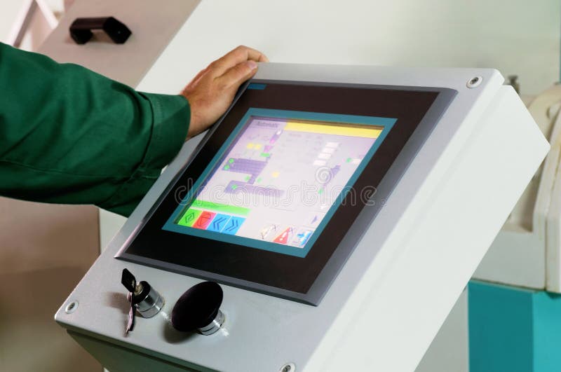 Man operating factory machinery stock photography