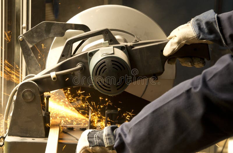 Man operating grinder