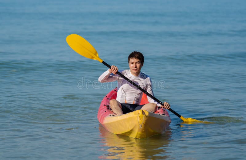 Man Paddling a Kayak Boat in Sea Stock Image Image of life, sport