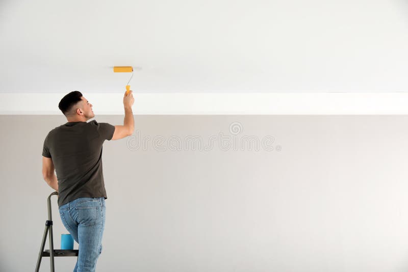 Rear View of Painter Man Looking at Blank Wall, with Paint Stick Stock  Image - Image of improvement, professional: 92914367