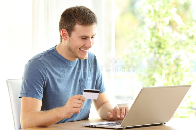 Man Paying on Line with Credit Card and a Laptop Stock Image - Image of ...