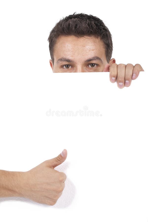 Man peeking behind empty white billboard