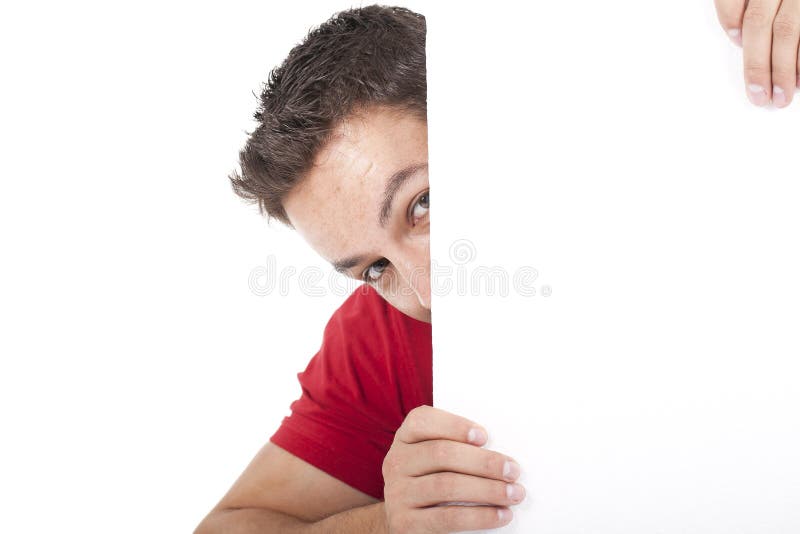 Man peeking behind empty white billboard