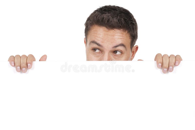 Man peeking behind empty white billboard