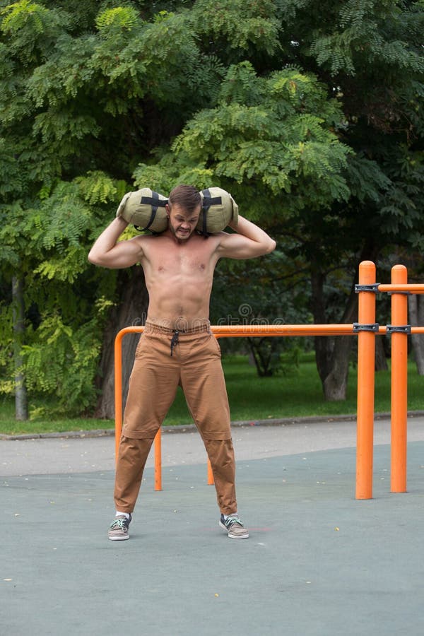 Man Performing Bag Squat Exercise Outdoor Stock Image Image of sport