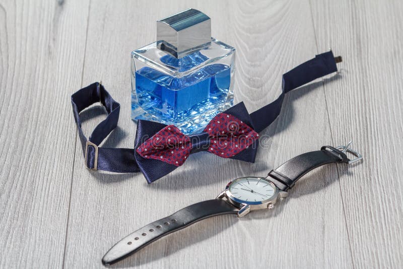 Man Perfume, Watch with a Black Leather Strap and Bow Tie Stock Photo ...