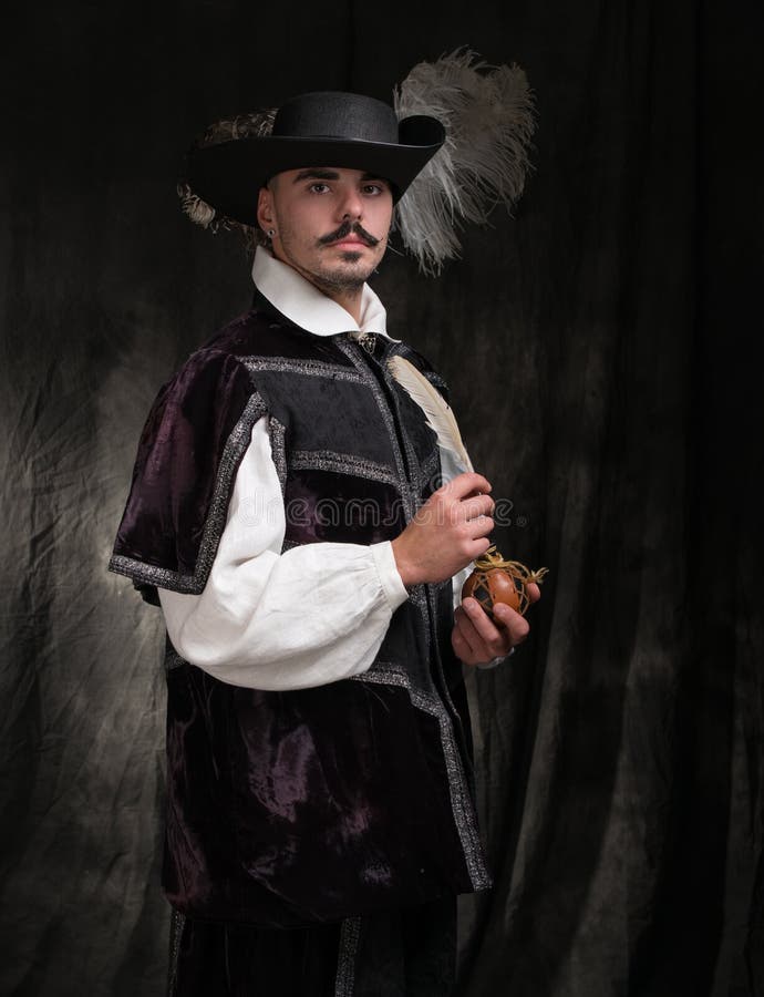 Man in period costume and hat with feather