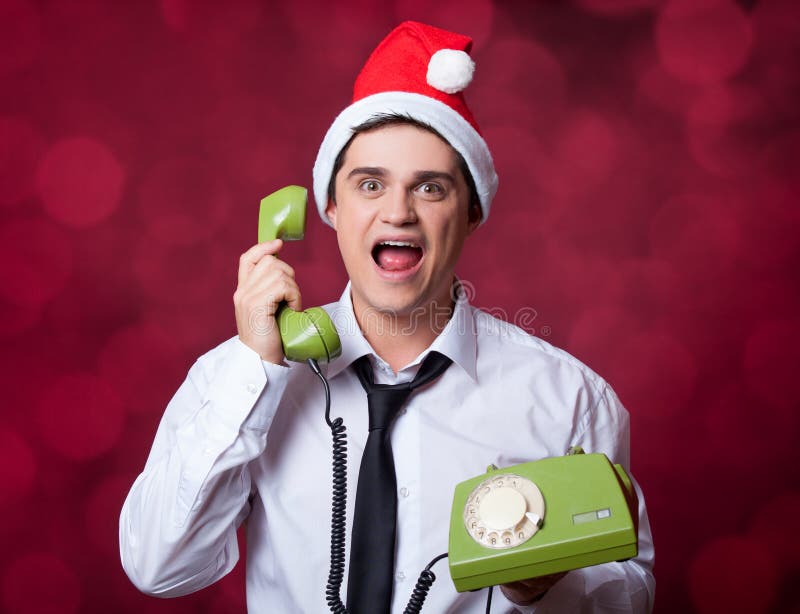 Man with retro phone on red background. Man with retro phone on red background