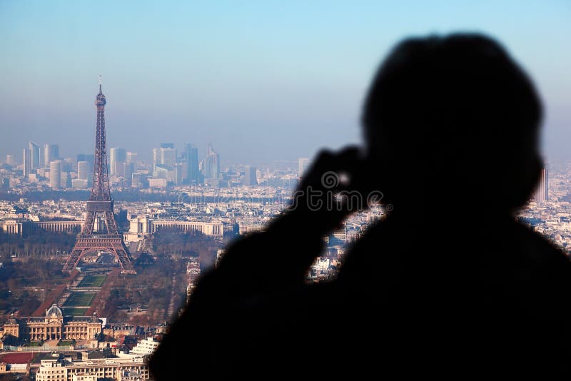 Man photographs panorama of Paris royalty free stock photography Man photographs panorama of Paris royalty free stock photography