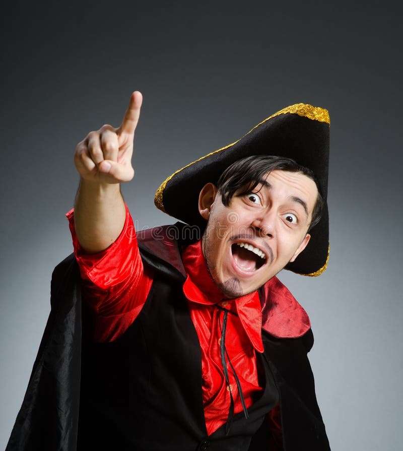 Man pirate against dark background stock image