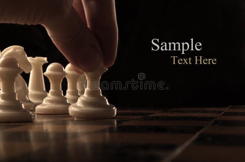 Hand Of A Man Taking A Chess Piece To Make The Next Move In A Chess Game.  Close Up. Spring Day Outside. Stock Photo, Picture and Royalty Free Image.  Image 198493640.