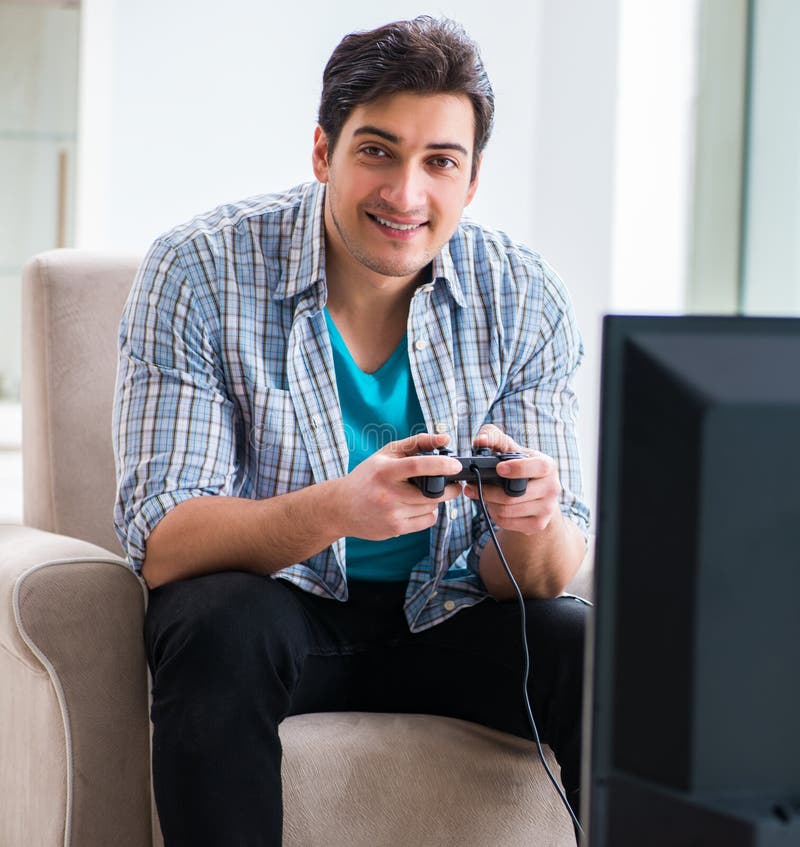 Man playing computer game at home royalty free stock image Man playing computer game at home royalty free stock image