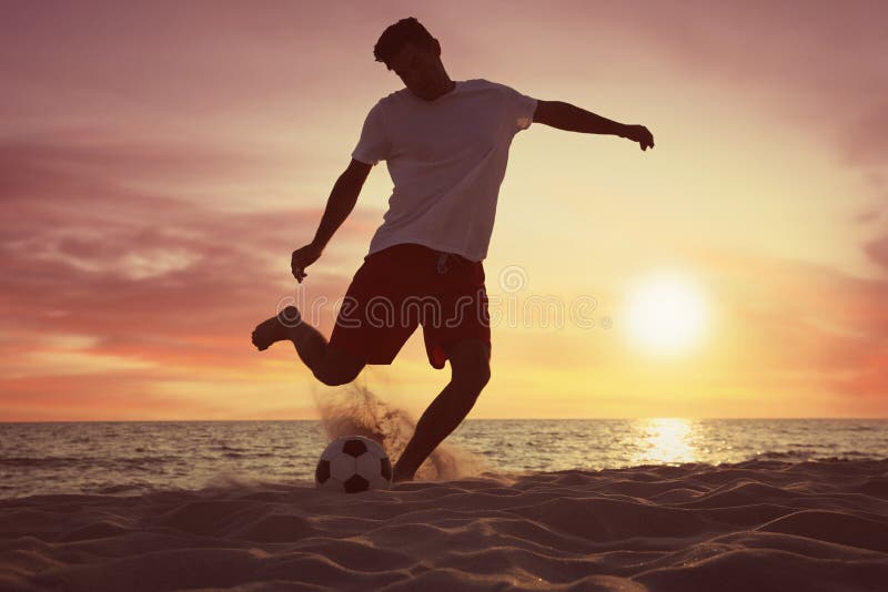 Man Playing Football on Beach at Sunset Stock Image Image of ocean