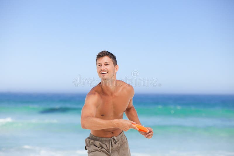 Man playing frisbee stock photography