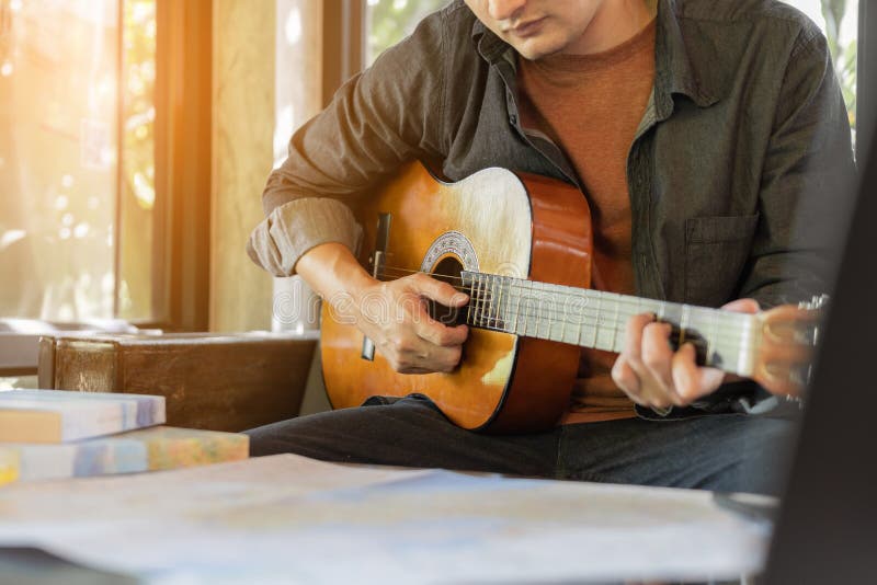 Man is Playing Guitar, Practicing in Playing Guitar Stock Image Image