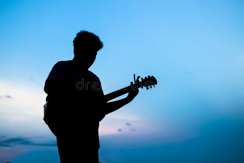 Man playing the guitar stock photo Man playing the guitar stock photo