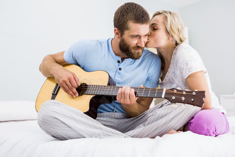 Guy Playing Guitar For Girl High Resolution Stock Photography And Images