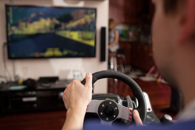 Man Playing Racing Game with Steering Wheel Stock Image Image of game