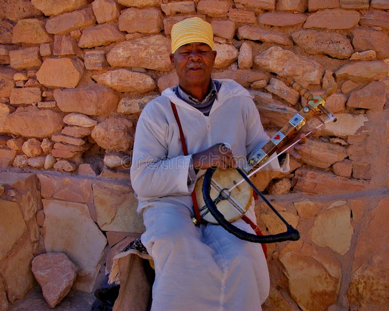 Man playing an stringed instrument in Marrakesh royalty free stock photography Man playing an stringed instrument in Marrakesh royalty free stock photography