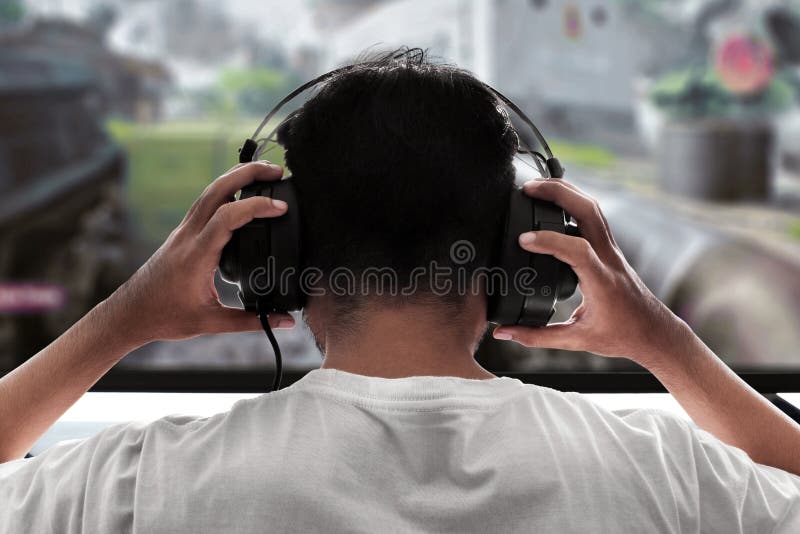 Man playing video games wear headphone