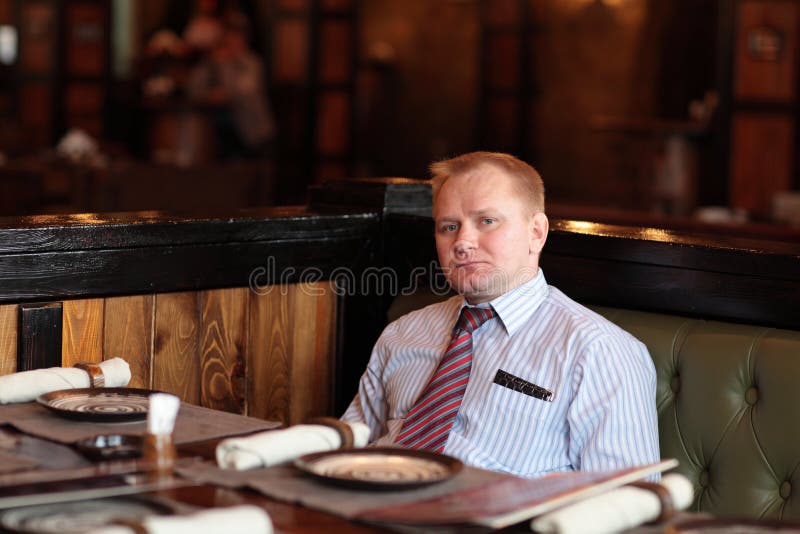 Man poses in restaurant