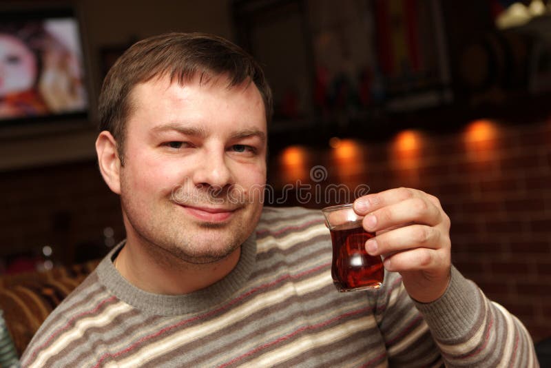 Man poses with tea