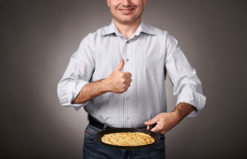 Man Posing with a Pancake in a Pan, White Shirt and Pants, Gray