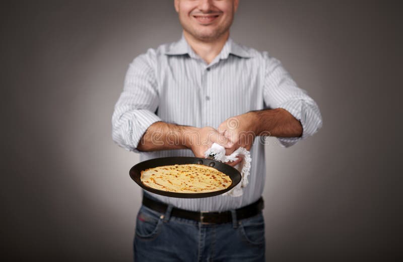 Man Posing with a Pancake in a Pan, White Shirt and Pants, Gray