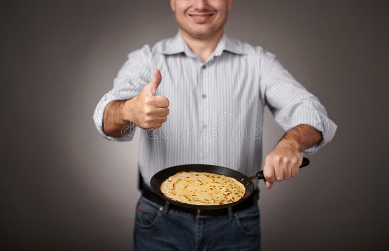 Man Posing with a Pancake in a Pan, White Shirt and Pants, Gray