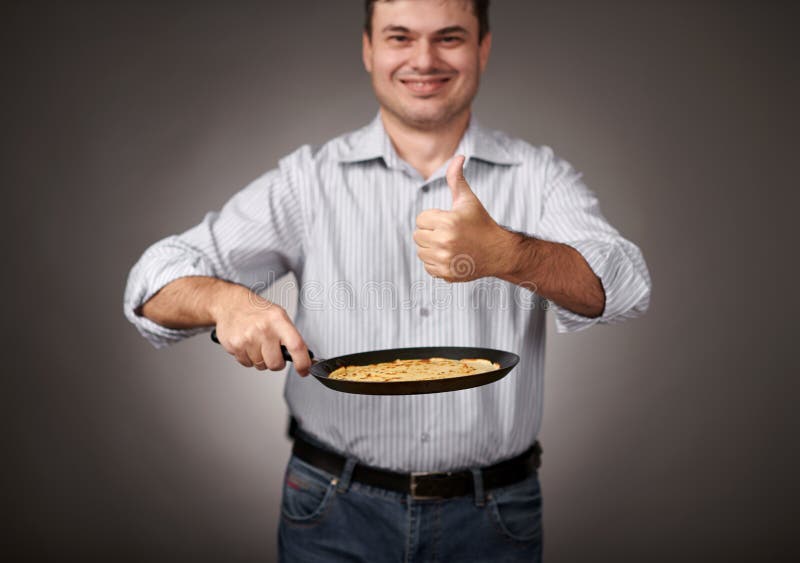 Man Posing with a Pancake in a Pan, White Shirt and Pants, Gray
