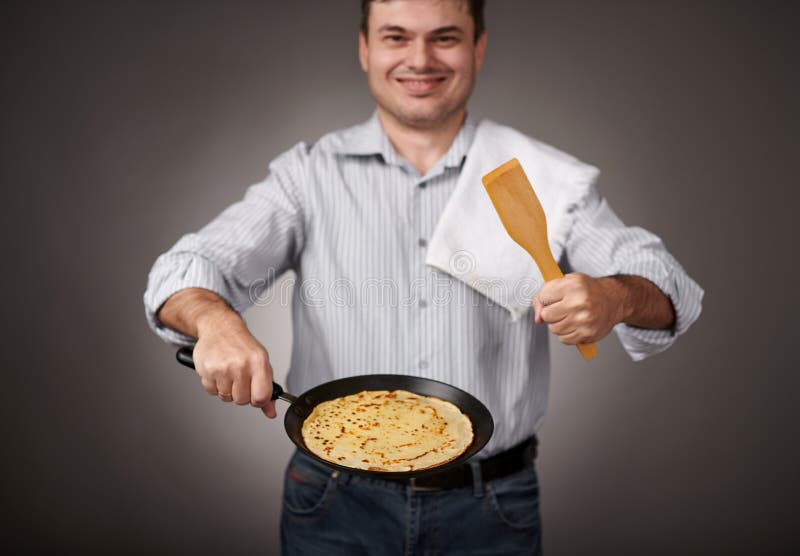 Man Posing with a Pancake in a Pan, White Shirt and Pants, Gray
