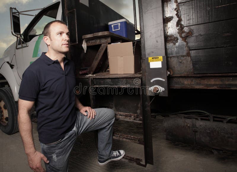 Man posing by a truck