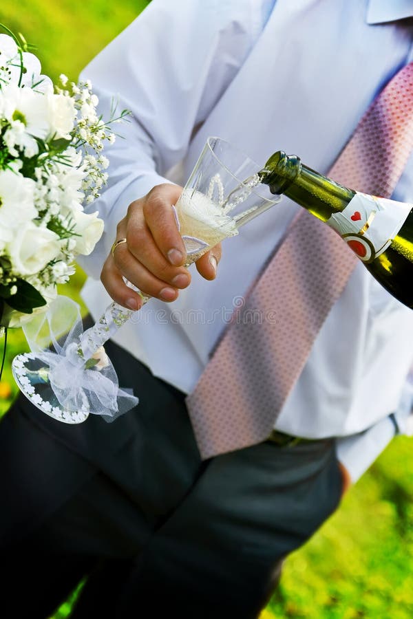 Man pouring champange to wineglass