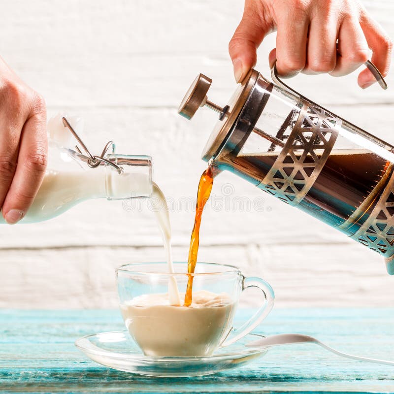 Pouring Coffee and Milk into a Cup Stock Photo Image of flavor