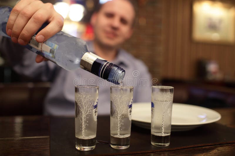 Man pouring vodka