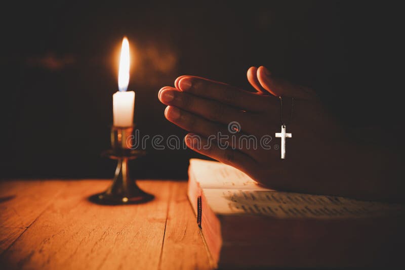 A Man Praying in the Bible with a Candle Stock Image Image of