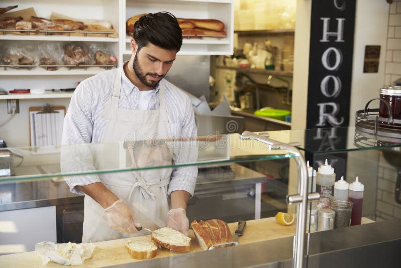 Man Preparing Food Behind the Counter at a Sandwich Bar Stock Image Image of apron, cafe 85208243