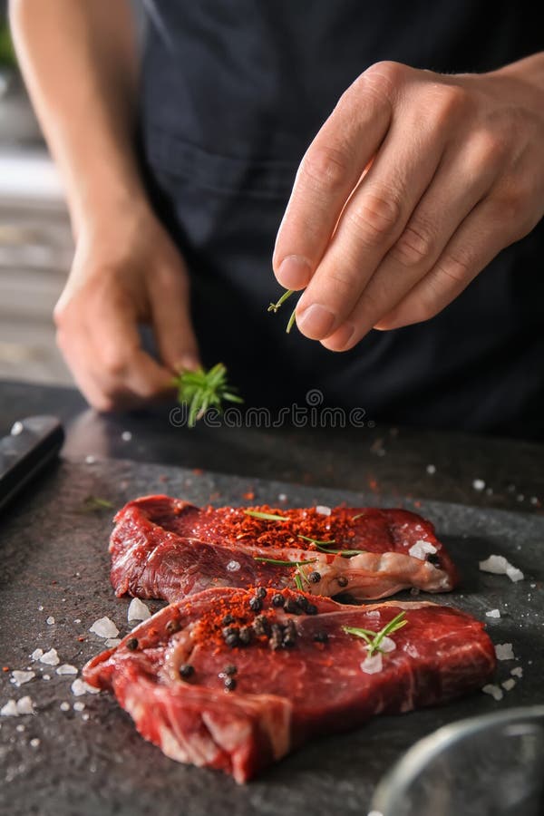 Man Preparing Meat in Kitchen Stock Image Image of background, herbs 151140661
