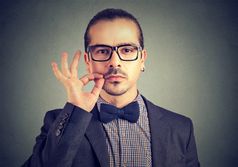 Man promising to keep secret stock photos Man promising to keep secret stock photos