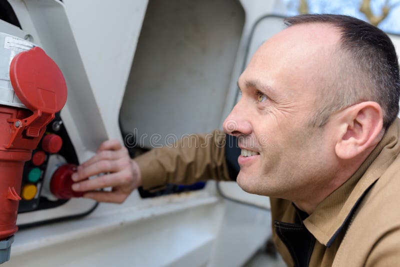Man pushing fire alarm stock photo Man pushing fire alarm stock photo