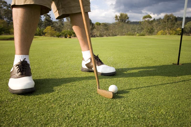 Man about to putt at golf course in australia. Man about to putt at golf course in australia