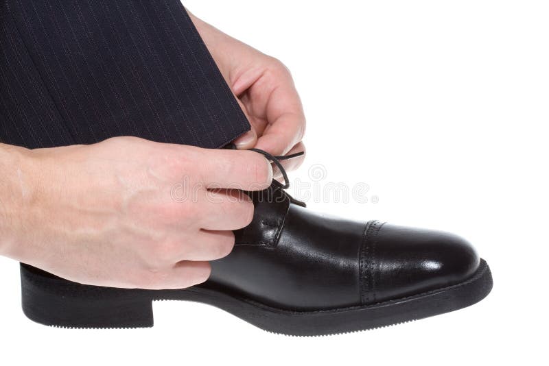 Man putting on black shoe stock image. Image of action 11877783