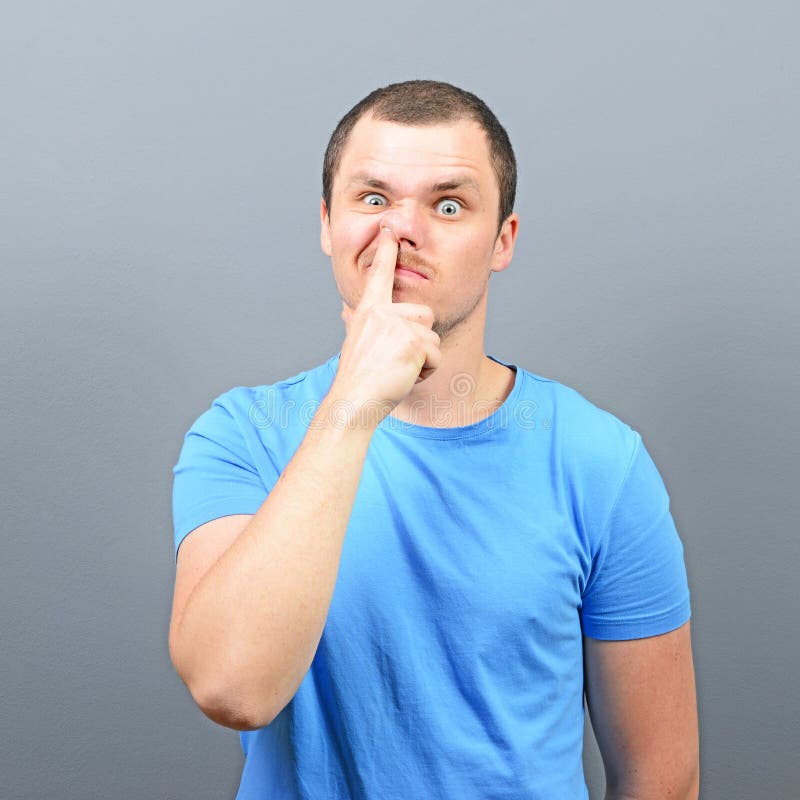 Man putting finger deep in his nose - Bad habit concept royalty free stock photos Man putting finger deep in his nose - Bad habit concept royalty free stock photos
