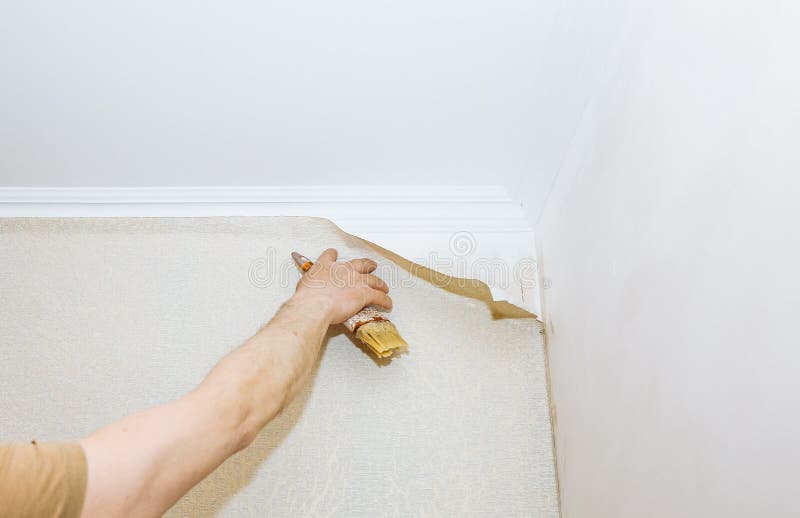 Man is Putting Glue on the Wall with Brush. Wallpaper Hanging. Maintenance  Repair Works Renovation in the Flat Stock Image - Image of house, male:  185543491