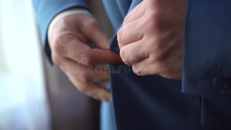 A man putting on a jacket